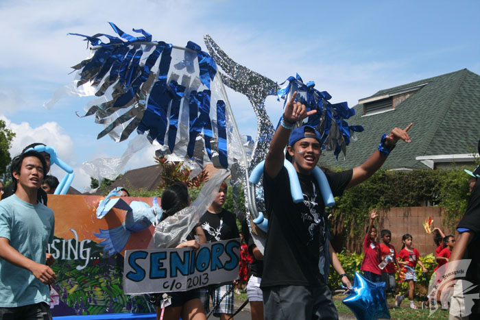 Senior Sylvester Poncillio tries to pump onlookers up as his class mascot, the blue and silver phoenix.