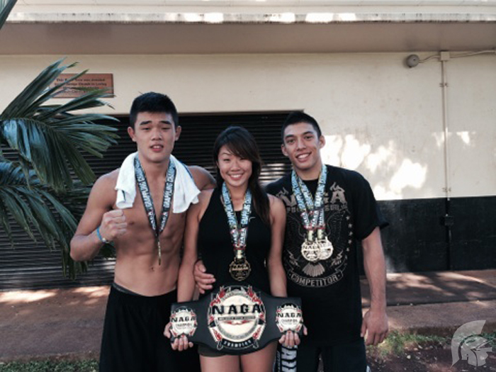 (Photo courtesy of Senior Angela Lee) (L-R) Sophomore Christian Lee took first and third place, Senior Angela Lee won four first place titles and alumnus Bobby Kim, who also competed in the NAGA tournament won two first place titles.