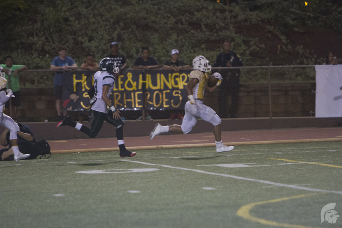 (Matthew Kawamoto | Trojan Times) At this years Homecoming Game, Running Back Vavae Malepeai (12) added 65 receiving and 56 rushing yards to create a total record of 106 completed yards for this season and 639 completed yards for his high school career. 