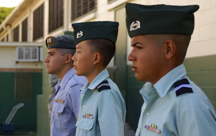 (Photo courtesy of Lt. Col. Timothy Schiller) (L-R): Jorge Aponte Alvarez Jr. (10), Jeffrey Lee (9) and Micah Chevalier (11) stand at the position of attention in a formation.