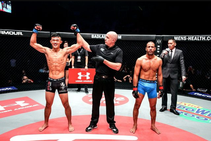 (Photo courtesy of Ken Lee) Christian Lee (12) (left) declared the winner against Mahmoud Mohamed at the ONE Championship: Clash of Heroes in Kuala Lumpur. Lee spent a month in Singapore undergoing training to be in top shape for the match.