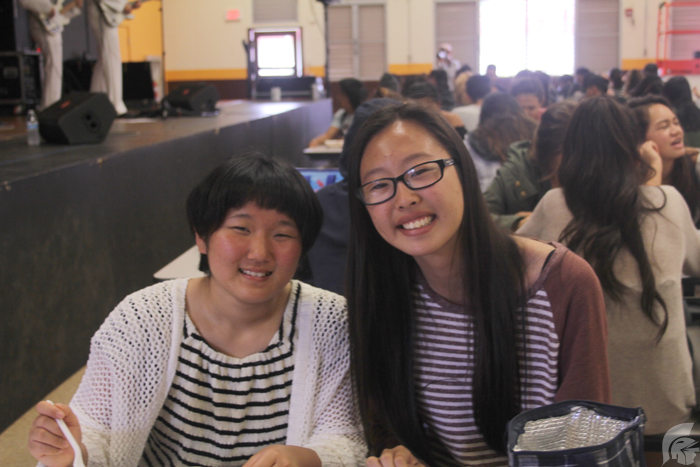 (Anika Ramos | Trojan Times) Kana Yokoyama, left, sits with Kana Morita (11), right, as part of the exchange program between Fuchu High School and MHS. The Japanese exchange students immersed themselves in Hawaii’s culture during their stay.  