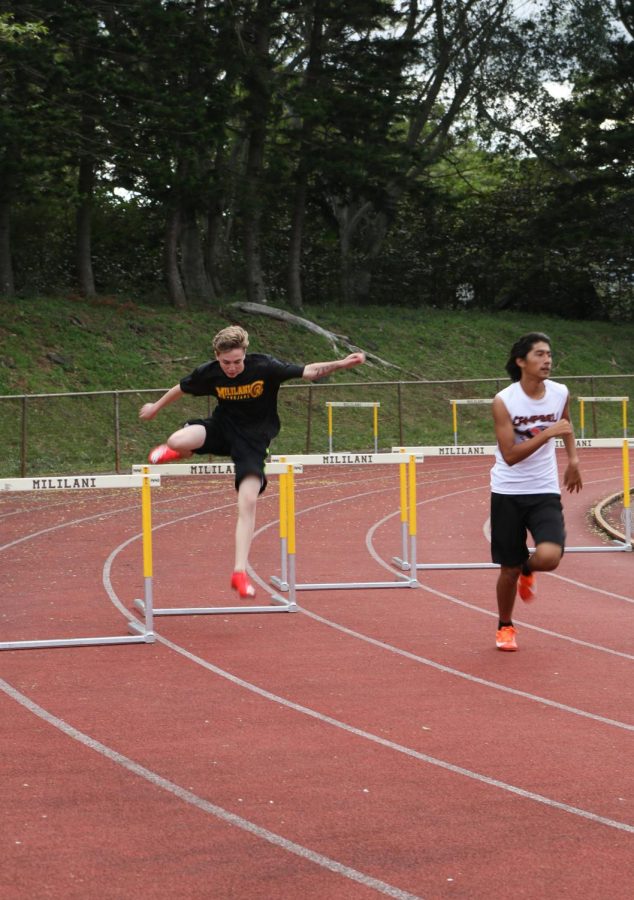 Joshua Leonard (10) competes in the 300 meter hurdles.