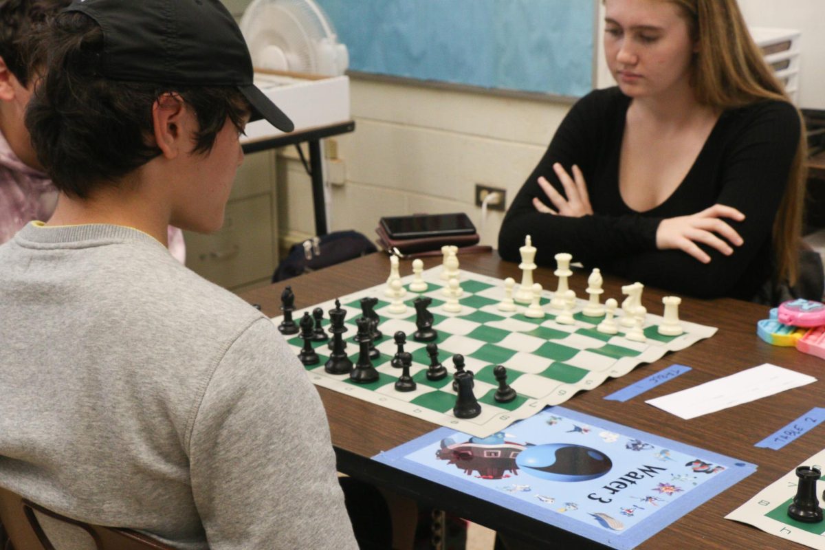 Senior Marcus Morifuji faces off against senior Ava Mayfield in a game of chess. The Tabletop Gaming Club
hosted its first chess tournament on Nov. 30, any student was welcome to participate.